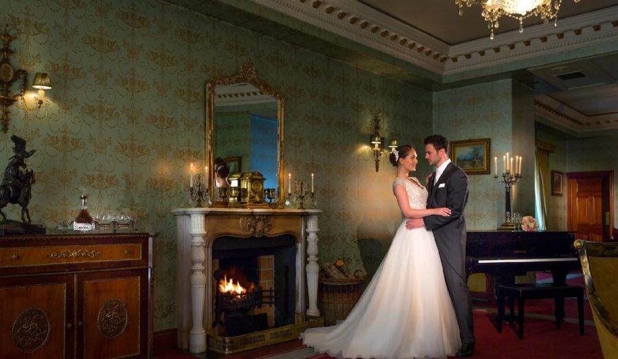 Glenlo-Abbey-Hotel-5-star-wedding-venue-Galway-ffrench-room-bride-groom-by-fire (Custom)