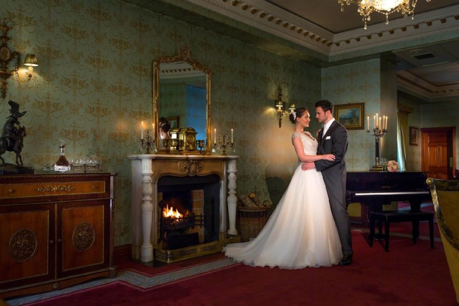 Glenlo-Abbey-Hotel-5-star-wedding-venue-Galway-ffrench-room-bride-groom-by-fire (Custom)