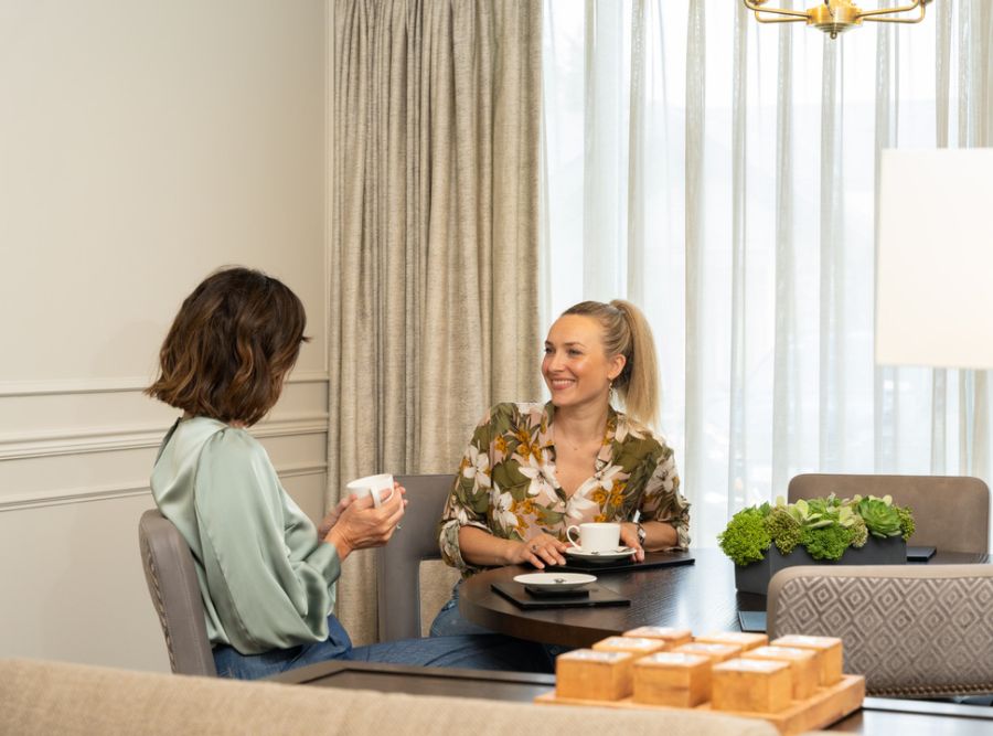 Internal The Lodges, mother and grandmother chatting at the table