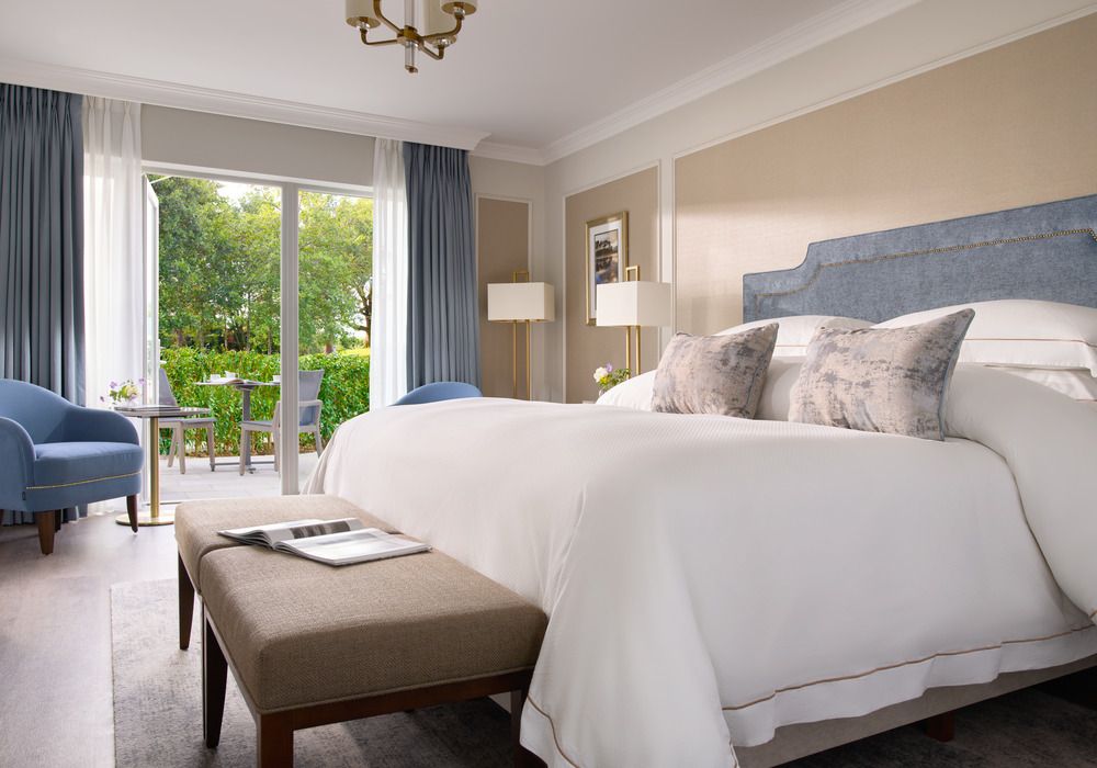 Lodge 2 Master Bedroom, blue headboard, outdoor view