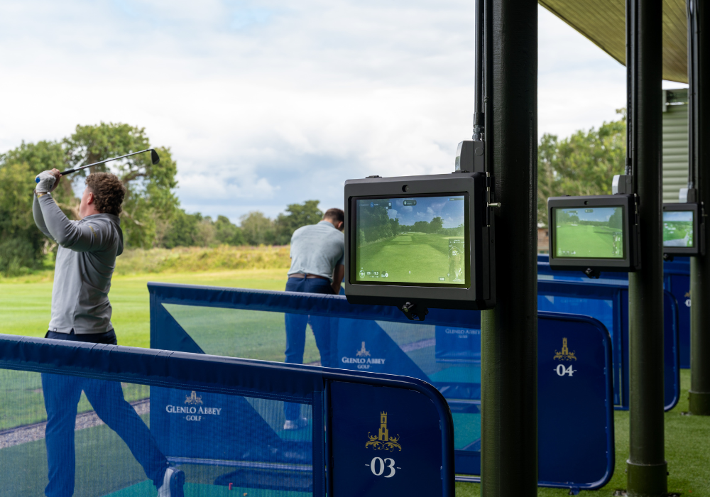 Trackman 2 Golfers - 1 Swinging - Primary Gallery