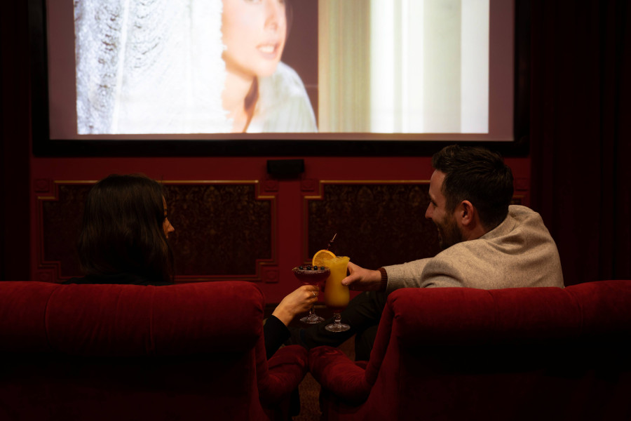 Couple in cinema cheers with cocktails www.glenloabbeyhotel.ie